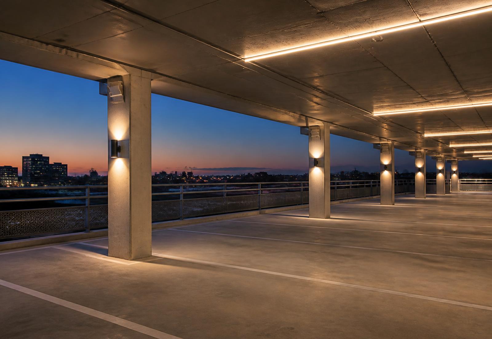 Evenly lit car park deck in a commercial building at dusk